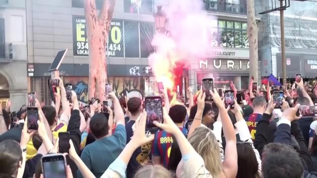On cloud nine Barcelona fans celebrate getting one over their fierce rivals Real Madrid to race towards Spanish La Liga crown